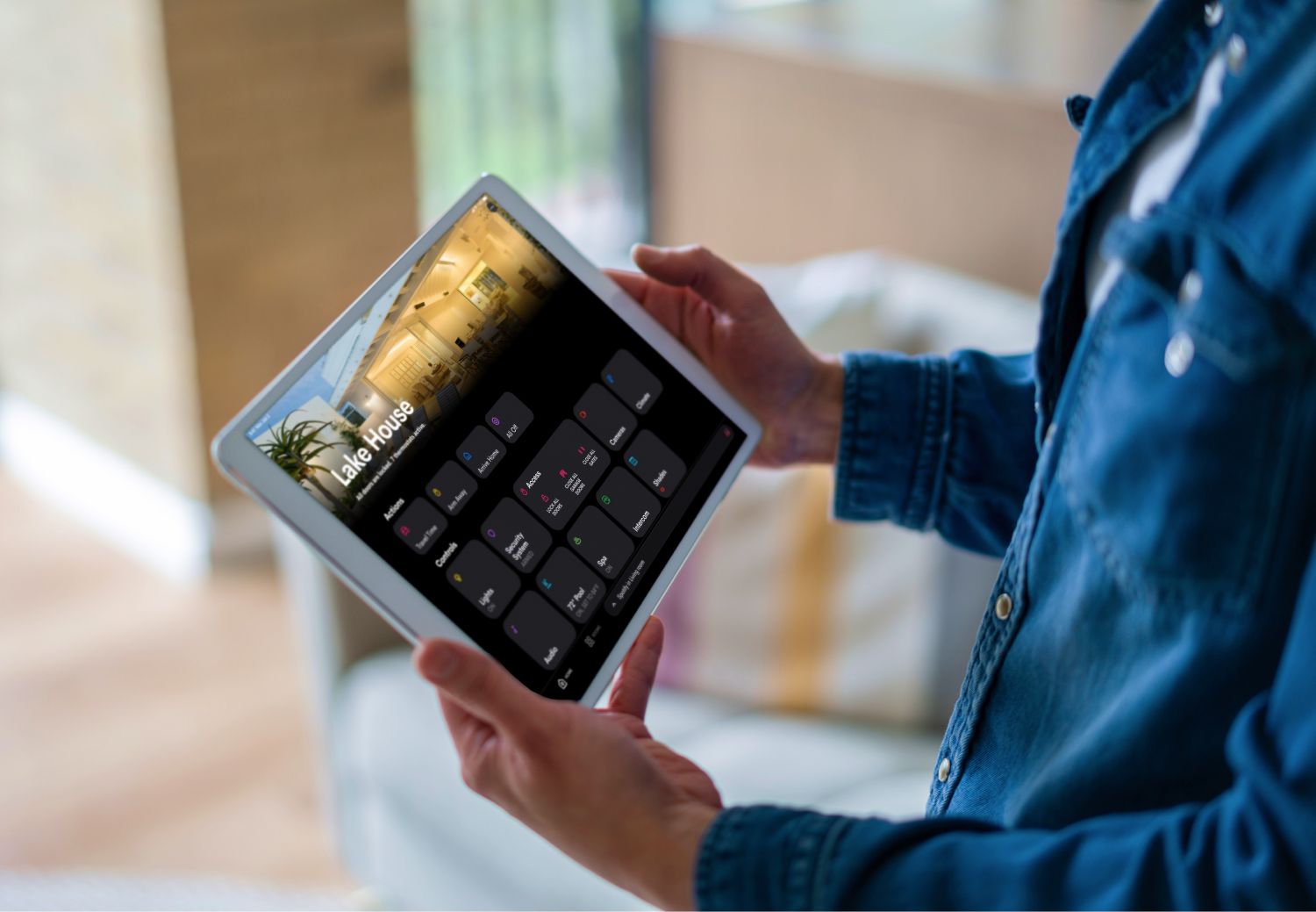 Control4 Touch panel in a able with a traditional home in the background